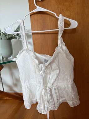 White Eyelet Tie-Front Sleeveless Peplum Top